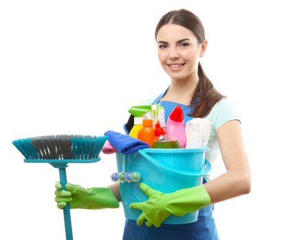 Cleaner tidying a kitchen and living space in Docklands