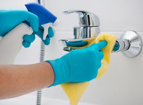 Cleaning glass surfaces and fixtures in a Docklands property