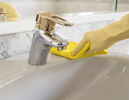 Local oven cleaner working in a Docklands high-rise kitchen